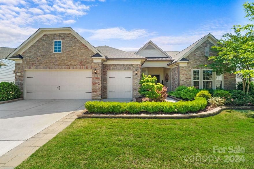 Welcome to your DREAM HOME in an active adult, resort-style community! Entry foyer leads you to a 1 level open-concept residence that has an amazing use of function & space plus decorator colors & finishes. A well appointed kitchen anchors the main living area w/ top of the line appls, quartz counters, tile backsplash, under cabinet lighting & gas cooktop. Dining area flows seamlessly to the screened in lanai & extended patio w/stone gas fireplace expanding in/outdoor entertaining areas. The fully fenced in backyard is beautifully landscaped w/ irrigation. Office/flex space plus a serene primary suite completes this home w/ dual sink vanities, zero entry shower plus a generous walk-in closet. So many features to mention from the low maintenance wood & tile floors (no carpet), laundry rm w/built in drop zone to the 2 car plus a golf cart garage for extended storage. This home is ideally located within the community, just a short walk to all the amenities Carolina Orchards has to offer!