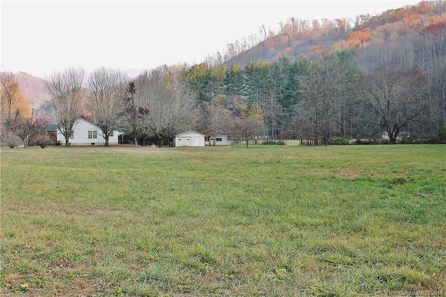 Looking pasture land? 13+/- acres with pasture! The circa 1945 farm house features hardwood floors, a large kitchen, breakfast room, 2 bedrooms and a jack-n-jill bath. It needs renovating, but the bones are great! New roof in 2012! Great location and unrestricted w/flat pasture. The house is located in the flood way and part of the land is in the flood plain. Private well, but city water/sewer is available. There is a fire hydrant on the corner.