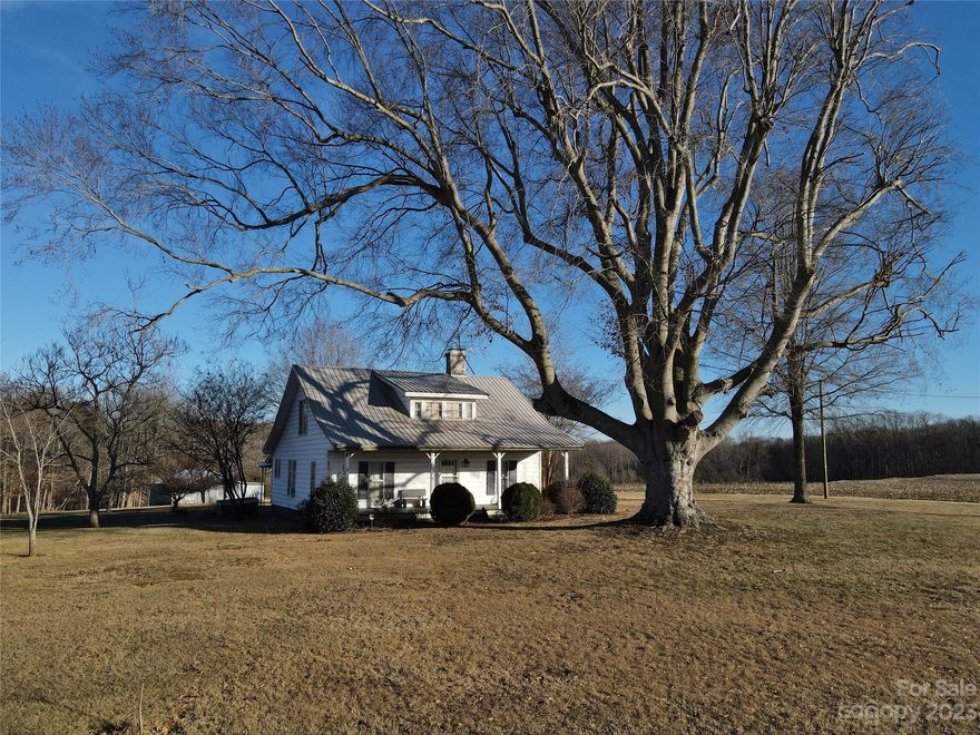 Seller conveying charming farmhouse and approx. 55 acres of beautiful sprawling acreage in the Cool Springs area of Iredell County! Two parcels to convey include 4767736489 (house and approx 1.96ac) and an approx 53 acre portion of 4767832374 (seller conveying property across road to other buyer). Beautiful property like this, is rare! Pond, stream/spring, a mixture of trees, open fields and pristine countryside. Home built in 1900.Recent metal roof. Two BRs on main floor and two BRs upstairs. Second floor does not have its own heat source. Main floor heat source is kerosene fueled Monitor-type heat unit. Numerous outbuildings/garage/storage sheds. Well on property. Jefferson Farm Rd is state-maintained. Buyer responsible for any rollback taxes. Home sold AS-IS,WHERE IS. Unable to locate septic permit with county. Personal property on site may remain w/property subject to mutual agreement. Appointment required ahead of time for property viewing. Also listed as land, see MLS 4104394