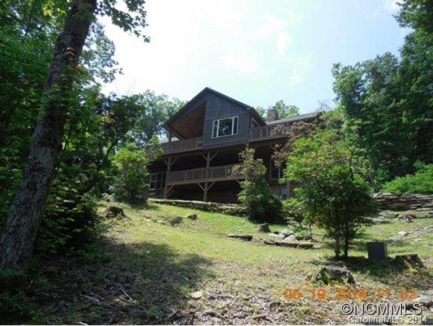 Enjoy beautiful lake and mountain views! This home has hardwood floors, 2 stone fireplaces, cathedral ceilings w/wood finish, stainless steel appliances, 4 bedrooms and 4 full bathrooms-ceramic tiled. Two decks for entertaining or just relaxing!