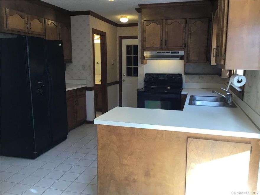 Well maintained home ready for your family, or excellent rental property.  Yard backs up to woods, and a large deck on the rear of the home make for wonderful outdoor entertaining.  Vaulted ceiling in master bedroom and TWO closets.  Bedrooms 2 & 3 are nice sized, one with a walk-in closet.  Wonderful investment opportunity to house your UNCC student!