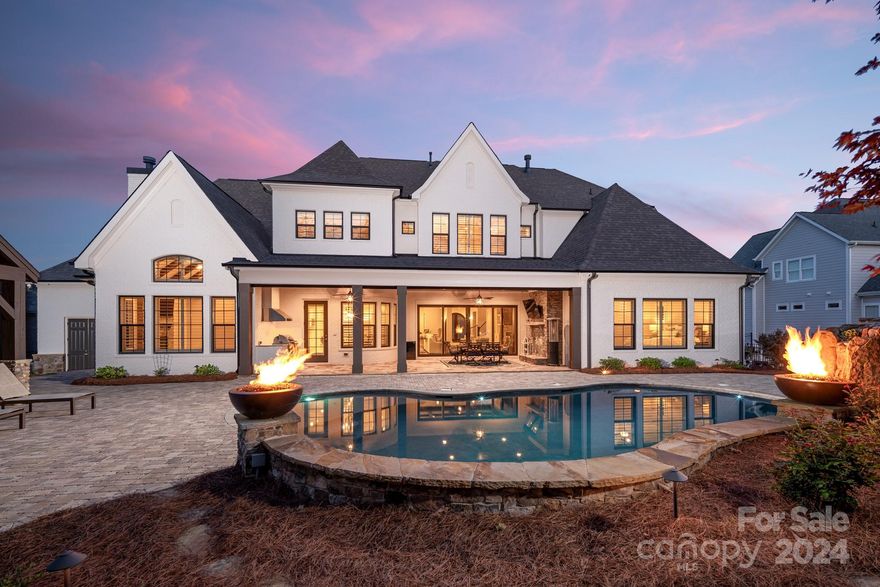 Step into luxury living at its finest with this stunning property boasting state-of-the-art features and impeccable design. Control every aspect of your home with ease using the Elan/Nice whole home automation system, from lighting to security cameras. Enjoy entertainment throughout with ceiling speakers and wall-mounted TVs, while custom plantation blinds provide the perfect balance of natural light and privacy. Retreat to the backyard oasis complete with a saltwater pool, spa, and outdoor entertainment area featuring a covered cabana with fireplace and grill. With a four-car garage, landscaped yard with irrigation system, and luxurious finishes throughout, this home is the epitome of elegance and convenience. Don't miss your chance to experience the ultimate in luxury living – schedule your showing today!