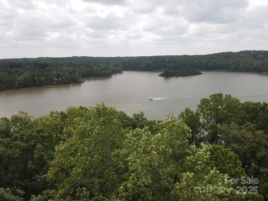 Your opportunity to own a rare main channel waterfront lot in the highly sought-after gated community of Reflection Pointe, complete with an approved dock design. This prime property offers breathtaking views and a lifestyle of leisure and luxury with access to a community pool, clubhouse, tennis courts, an athletic field, walking trails, and a pavilion with beach area. Located less than 20 miles from Uptown Charlotte and just a short drive to the charming shops and restaurants of downtown Belmont, this lot combines the beauty of lakeside living with the convenience of city access.