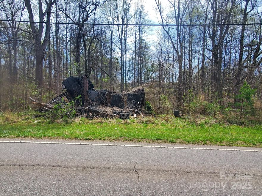 385' OF ROAD FRONTAGE ON HWY 70 IN STATESVILLE. THREE PARCELS COMBINED FOR A TOTAL OF 1.77 ACRES ZONED B-5 (HIGHWAY BUSINESS), across from THOR-LO. THERE IS AN OLD BOARDED-UP BURNT DOWN HOUSE ON ONE OF THE PARCELS. THIS HOUSE BURNED IN 2009 AND IS OF NO VALUE. MOTIVATED SELLER. BRING ALL OFFERS.