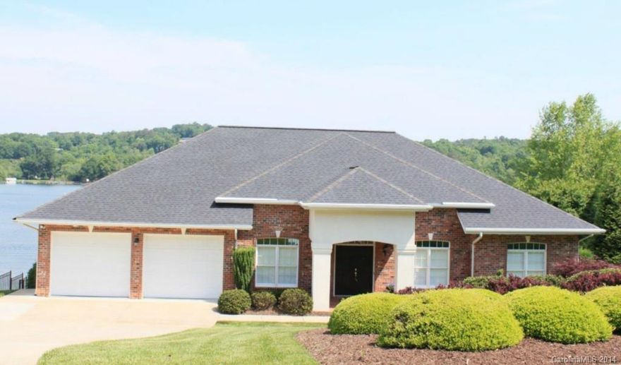 LAKE HICKORY WATERFRONT 4BR/3.5BA Custom Built w/Lake Views in Mind. Main Level Master Suite. Kitchen w/Granite Countertops, Gas Cooktop,  Double Ovens, Microwave & Dishwasher. Breakfast Nook. Dining Room &  Living Room w/Gas. Den w/wet Bar, Cathedral Ceiling & Built-ins. Lower Level Features Spacious Guest Suite, Exercise/Office, Great Room w/Dining Area, FP, Island/Bar Area w/Fridge, Sink & Dishwasher. Deck. Covered Patio W/Fans. Covered BOAT DOCK w/LIFT. Security & Irrigation Systems.