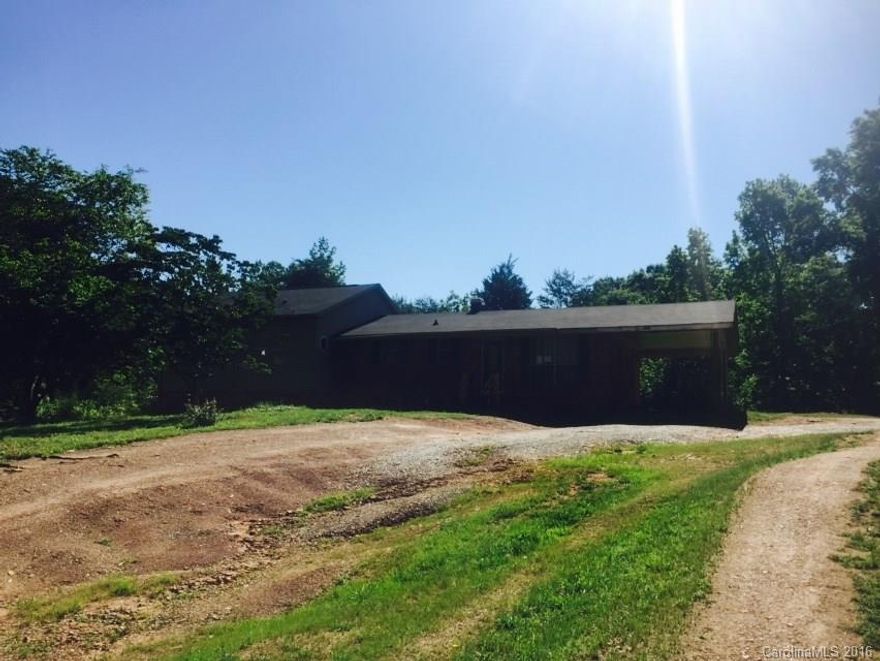ATTENTION INVESTORS!!  FIXER-UPPER ON 3+ ACRES IN MAIDEN!!  This home offers 3 bedrooms, 2 baths, a living room, kitchen with dining area, an attached 1 car carport and a large 3.8 acre lot!!  BRING OFFERS!!