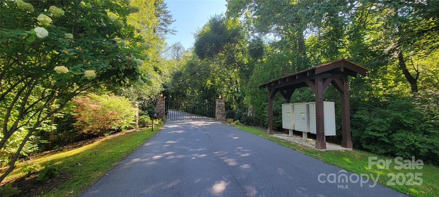 Pretty 1.29 ac subdivision lot located at end of cul-de-sac in gated community with wide paved subd streets, public water & sewer, UG Elec, High Speed Internet [Optimum], fire hydrant at cul-de-sac and mountain views w/tree cutting or trimming.  Located in Cullowhee NC within 1 mile of WCU [Western Carolina University].  1400 min heated SF required with 1200 SF on main level [CCR Amendment recorded in DB 2379, page 1420 JCR, 6/26/24].  Knoll [most southern] boundary line recently flagged by licensed surveyor with red ribbons. Driveway pre-excavated. Nice lot for spec or custom home.