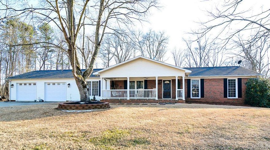 Rare find in Ft Mill area lake front on almost an acre! Quiet neighborhood that is close to everything. This property includes 3 lake front parcels that are perfect for building a dock to fish, kayak or simply relax! This home was remodeled and added to in 2002 with an open floor plan.  The eat in kitchen has custom oak cabinetry, granite counter tops, double oven and stainless appliances.  Attached,finished,oversized 2 car garage.  Large detached workshop with studio/loft, basement. Playset neg