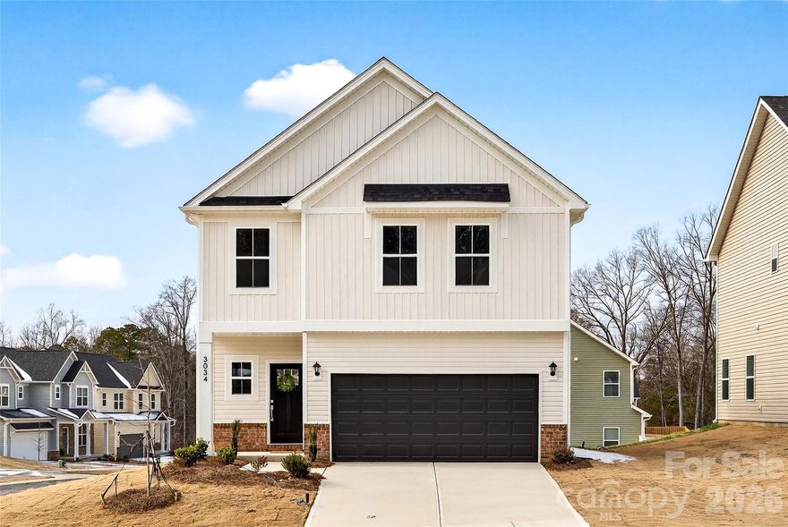 MOVE-IN READY!
$10,000 in seller concessions when you use the builder’s preferred lender—perfect for a rate buydown or help with closing costs.** Ask agent for details.

Welcome to The Pines at Paw Creek—a hidden gem tucked near the freeway, just minutes from the airport and the excitement of the U.S. National Whitewater Center!

Step inside this charming 4-bedroom new construction home with a versatile loft, and you’ll instantly feel the thoughtful design and attention to detail. The spacious primary suite boasts a generous walk-in closet, dual sinks, and a gorgeous tiled walk-in shower framed in glass—your own personal retreat.

The light-filled first floor flows effortlessly from the inviting great room into a bright, open kitchen. Here, you’ll find elegant Quartz countertops, sleek stainless steel appliances, and a large island perfect for cooking, gathering, and creating memories.

Come experience the warmth, comfort, and character this home offers—it’s truly a must-see!