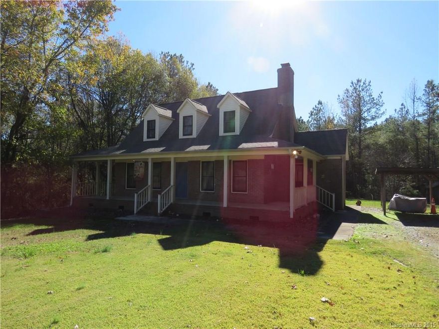 Total Privacy!  Move – in Ready Home features hardwood flooring throughout with lots of storage space and enjoyable, wraparound front porch with side entry and 2 car carport.