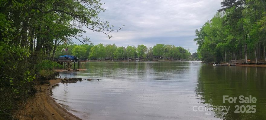 Beautiful lake front lot on High Rock Lake. Located in the gated community of Sunset Pointe with 202 feet of waterfront shoreline perfect for a floating dock. The lot is flat to very gentle sloping allowing easy access to the waterfront. Located in the middle of a small cove with big water views but far enough in the cove for limited gentle, quite water. The lot is across the street from the clubhouse, community pool and recreation center. The community also has a community boat ramp for launching your boat. This truly is an exceptional lot close to the amenities of historic Salisbury, NC. This is a gated community so you will need an appointment to access this listing.