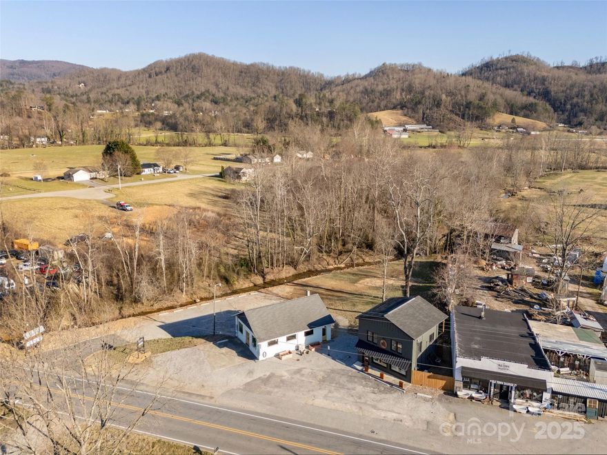 Magnificent user &/or investment opportunity property located in scenic Cane Creek valley between
Fairview and Fletcher! This multi-functional, highly versatile, meticulously renovated property
operates 3 businesses within 2 buildings including a street-level, 672 sf, 2-rm luxury spa with bath
& retail space, a 732 sf, 2nd flr, 2Bd 1Bt short term rental unit or potential AirBnB (1462 Cane
Creek) & 1,200 sf small business space potentially suitable for retail, group events, coffee shop,
or small business services (1464 Cane Creek)! Abundant parking & full, 1,200 sf unfin. basement -
great for storage, crafts, or expanded leasing opportunity! Turn key ready for use or business now!