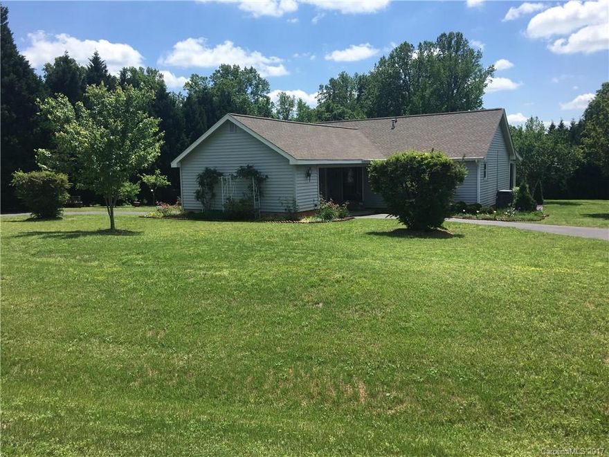 Private setting on over 1 acre split open floor plan ranch with circular drive with two car carport.  This home is adorable.  You will not believe it.  Show and it will sell itself!