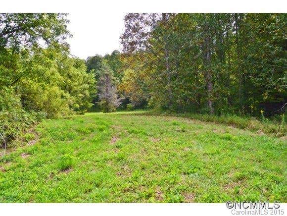 REDUCED! Very private 60.47 acre unrestricted, mostly wooded, tract in Madison County, NC with paved road frontage! Several beautiful home-sites with potential long range views. Property would be an ideal investment for the buyer interested in hunting/recreational activities or family compound. Possible OWNER FINANCING! The property is located approximately 28 minutes from downtown Asheville, 20 minutes to Weaverville, 15 minutes to Burnsville and 10 mins to Mars Hill.