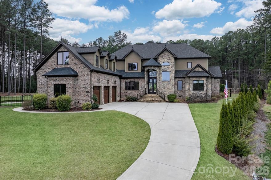 Stunning resort-style living in the highly sought-after Norman Pointe community, just minutes from Lake Norman. This beautifully designed home features an open-concept layout with soaring ceilings, abundant natural light, and elevated finishes throughout. The gourmet kitchen offers premium appliances, custom cabinetry, expansive counter space, and a large island perfect for gathering. The main-level primary suite provides a private retreat with a spa-inspired bath and direct access to the outdoor living area. A secondary bedroom on the main floor allows for convenient guest accommodations. Step outside to your own private oasis, complete with a custom pool and spa with stone grotto, outdoor fireplace and gazebo, built-in grill, pool house, and a professionally designed putting green. Ideal for entertaining or relaxing year-round. Located in desirable Norman Pointe with community boat storage and close proximity to Lake Norman, this home perfectly blends luxury, comfort, and lakeside lifestyle.