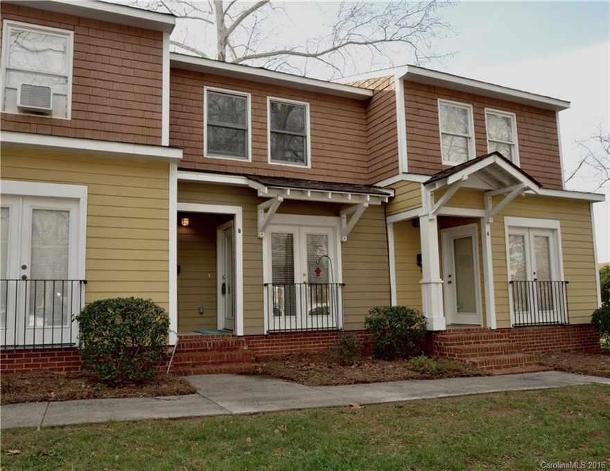 Looking for a great location at a price you can afford? Check it out!! Two story condo blocks from CPCC and minutes from Uptown. Move right in to this charmer.  Beautiful new hand scraped espresso floors in living room and new solid wood stairs gleam.  Fresh paint through out.  Spacious kitchen with tile floor and all appliances.   Downstairs is a large half bath with stacking washer and dryer.  Upstairs there are two nice bedrooms and a large bath.  Cute patio too.