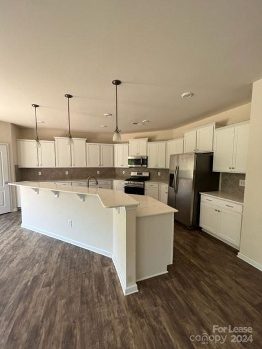 Absolute stunning true 5 bedroom home, with 3.5 bathrooms!  Luxury vinyl flooring throughout main floor and plush carpets on stairs and upper level.  White gourmet kitchen with huge island, plus kitchen eating area, open to your 2-story family room featuring gas fire place and a wall of windows!  Office as you enter and formal dining room with decorative moldings finish the main floor. Upstairs enjoy your grand primary bedroom with views of the pond, your ensuite primary bathroom with soaking tub and large walk-in closet.  You will also find 4 oversized secondary bedrooms upstairs, generous closets, Jack & Jill bathroom & loft.  Fully fenced level back yard (with small trail to pond out back!)  Washer & dryer included.  Amenity rich community ... Call your agent today!  (Small dogs accepted on case by case.  NO CATS.)