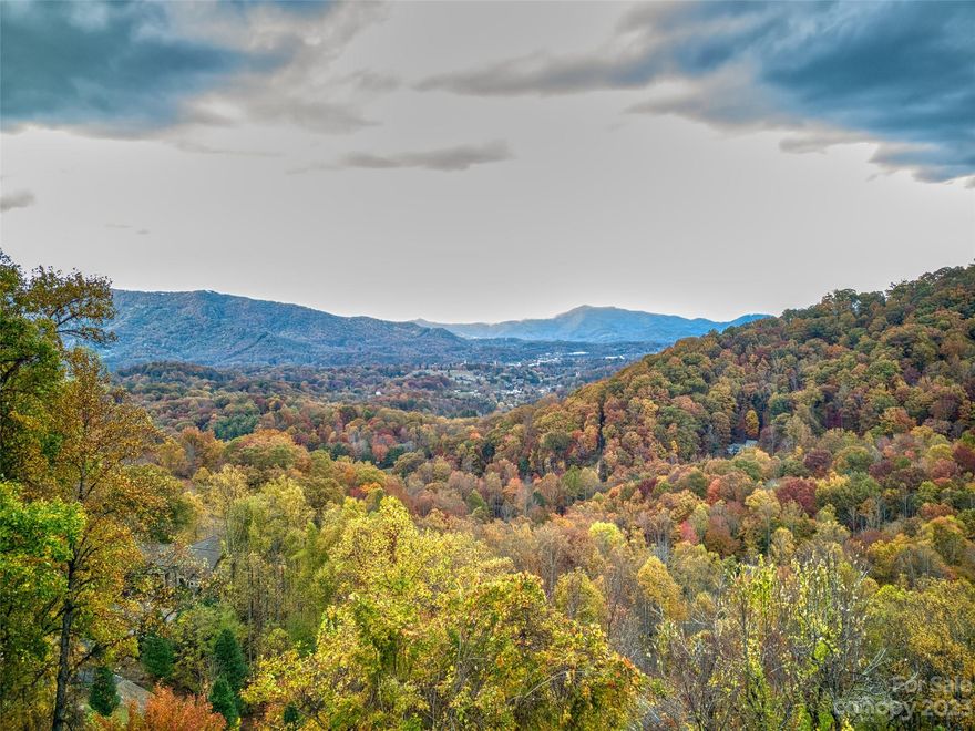 Take in a tapestry of majestic mountains as far as the eye can see from this 2.7 acre homesite. Nestled in the enchanting Whispering Woods at Sanctuary Cove. Don't miss the chance to build your dream home in this peaceful haven.