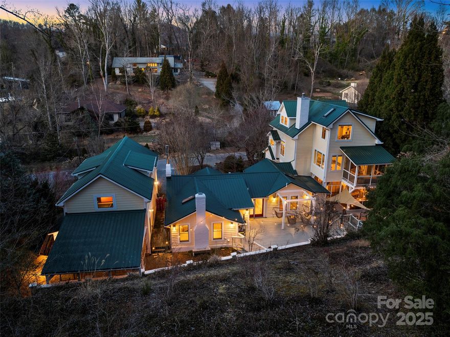 This magical, original Beaverdam home has been beautifully updated with a three story addition plus a fabulous separate, 1,157 sq ft industrial artist’s loft (not included in square footage). Enjoy mountain privacy at its best surrounded by quiet woods in your own life-size 'treehouse' enveloped by mature greenery and natural light. Inside, playful details include painted reclaimed cabinets, original fireplaces, an integrative children's play fort in the oversized kitchen island, true Turkish tile, main level screened porch and 4" white Oak hardwood floors. Soaring ceilings in the main living space invite creative expression and comfortable relaxation. The private second level primary suite features an expansive floor-to-ceiling custom closet system, and a fully screened sleeping porch for lazy summer nights. Guests can unwind in the main level guest beds or in the third story bedrooms. Conveniently located close to vibrant downtown Asheville, this creative haven is a special retreat.