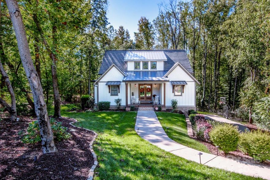 You'll be wowed upon entering this meticulously maintained,immaculate,move-in-ready 4-bdrm,4.5-bath waterfront home featuring custom finishes throughout w/room for a pool. No expense was spared in designing this amazing home! The natural wide plank floors,extensive trim work,tile work,moldings & built-ins showcase the attention to detail in every room. The stunning chef’s kitchen is equipped w/Bosch appliances,wet bar & a spacious layout perfect for entertaining flowing seamlessly into the open floor plan. Enjoy paddle boarding/kayaking right from your own backyard,then relax in the large vaulted screened-in porch or by the outdoor paver patio w/firepit. The fenced yard offers privacy while the finished basement includes a rec room & full bath.The xlarge garage easily fits large vehicles w/room for a workshop or storage. The primary suite is on the main level & upstairs you’ll find 3 bdrms w/en-suite baths & custom built-ins,laundry chute  plus a spacious loft. Bsmt 704sqft unpermitted