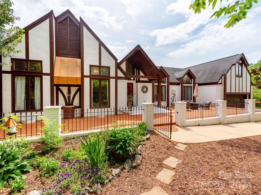 The well-sought after "Fort Mill Estate" is up for sale! The Equestrian Friendly Estate is a Rare opportunity to acquire a Private 1.5-Story English Tudor Home, w/ 6 stall barn including wash & tack room, while resting on 10.30 Acres filled w/ Exotic trees, Gardens, Creeks, & Fenced Pasture Land. This Property is Rare in so many fashions including a Riding Arena, Riding Trails, 2 Terraces in the Front & Backyard, followed by an oversized in-ground pool! The Colossal Master-Suite is situated on the West Wing of the Home w/ High Ceilings, a Fireplace, & a Private Deck Leading to the Secret Gardens. The East Wing of the Home offers an Apartment/Mother-In-Law Suite w a separate entrance. Enjoy Reading in the Sun Room or cooking in the Chefs Kitchen w amazing views of the property.  This home offers the Highest Ranked schools being zoned in Fort Mill, & has very low taxes of $3200 per YEAR.  This is undeniably the most premium location & rare Home in Fort Mill!