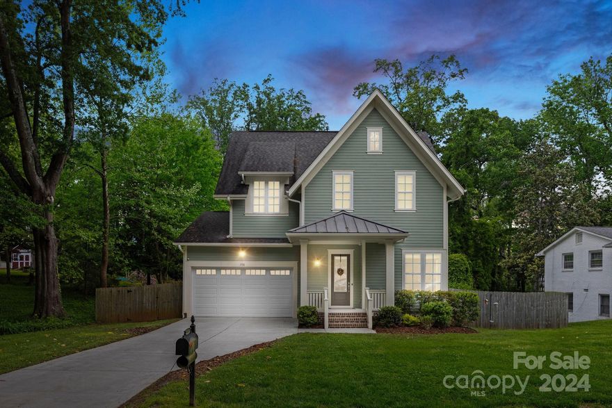 Welcome to 1701 Flynnwood Drive, a newer home nestled in the Merry Oaks neighborhood just a hop skip from Plaza Midwood. This delightful residence boasts 4 bedrooms and 3.5 bathrooms, offering plenty of space to make your own. Step inside and discover the open floor plan and 10 ft ceilings that create a spacious and airy atmosphere. The primary bedroom is an owner's retreat with an oversized room, two walk-in closets, double vanities and garden tub in the bathroom. The open kitchen and large island are perfect for hosting guests. When the weather cools down, cozy up by the indoor fireplace or head outside to sit around the fire table. In warmer weather, entertain on the back deck built with Trex boards and cook up a storm in the outdoor kitchen featuring a built-in refrigerator, large granite countertops, a built-in Green Egg smoker and a gas grill. The fully fenced large lot offers tons of privacy. This home is perfect for comfortable, easy living close to all Charlotte has to offer!