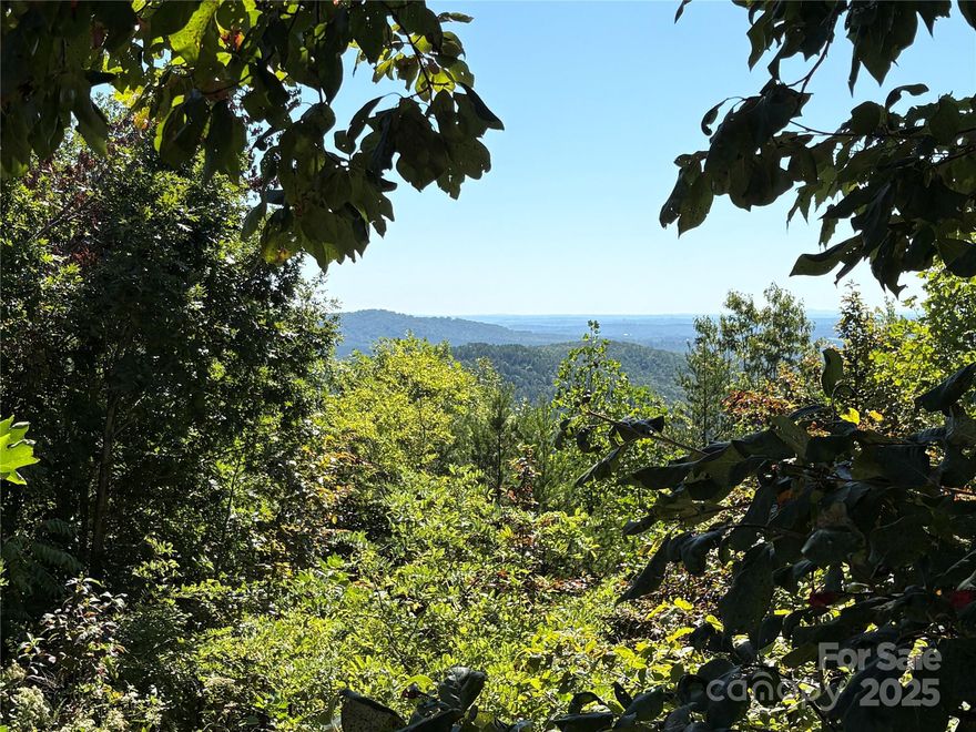 Beautiful 1.3 Acre Buildable Lot with Mountain Views in South Mountain Peaks 

Welcome to your future mountain retreat! This stunning 1.3-acre lot is located in the peaceful, gated community of South Mountain Peaks. This lot offers long-range mountain views that must be seen to be believed. With a minimum build requirement of 1200 sq ft, it's the perfect opportunity to create your dream home or vacation property. This property features a relatively flat terrain, making it ideal for building your dream home.

Enjoy the tranquility of nature while being just minutes from the fun at Jellystone Campground approximately 15 miles from the amenities of Forest City and downtown Rutherfordton. Whether you are looking to build now or invest for the future, this lot is priced to sell-don't miss out!