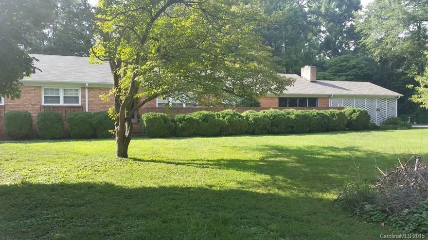 Brick Ranch with spacious rooms thru out, Formal Living and Dining, den with fireplace, kitchen/breakfast, 3 large bedrooms 2 full bath. Jacuzzi tub, Bonus room with fireplace, 2 level deck out back with inground pool ( pool needs new liner and possibly pump) .73 acre lot mins from downtown. House needs some TLC but to be Sold AS IS Where IS!! Estate sale. Family will finish removing personal items. Great yard has 2 big Magnolia trees in Front.