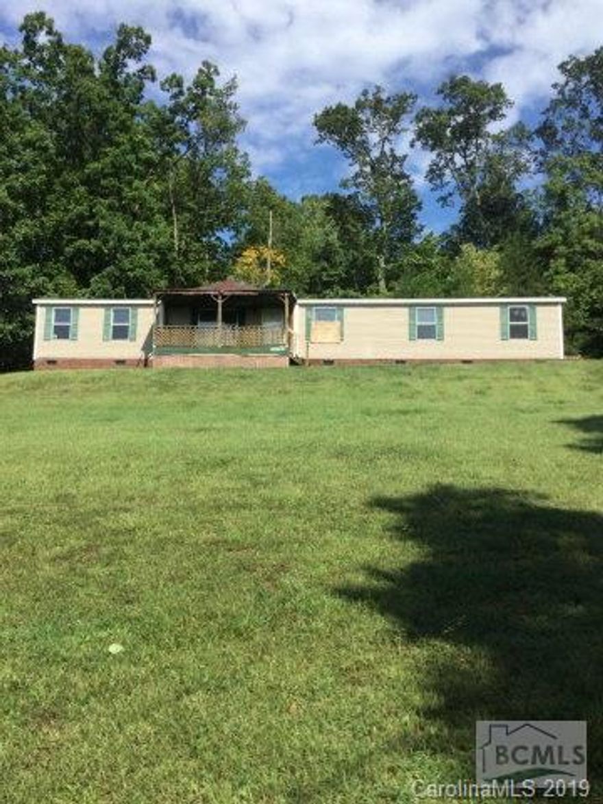 3 bedroom 2 bath doublewide on 0.84 acres. Home has additional great room and sitting area in master bedroom. Lots of square footage! Great investment opportunity!