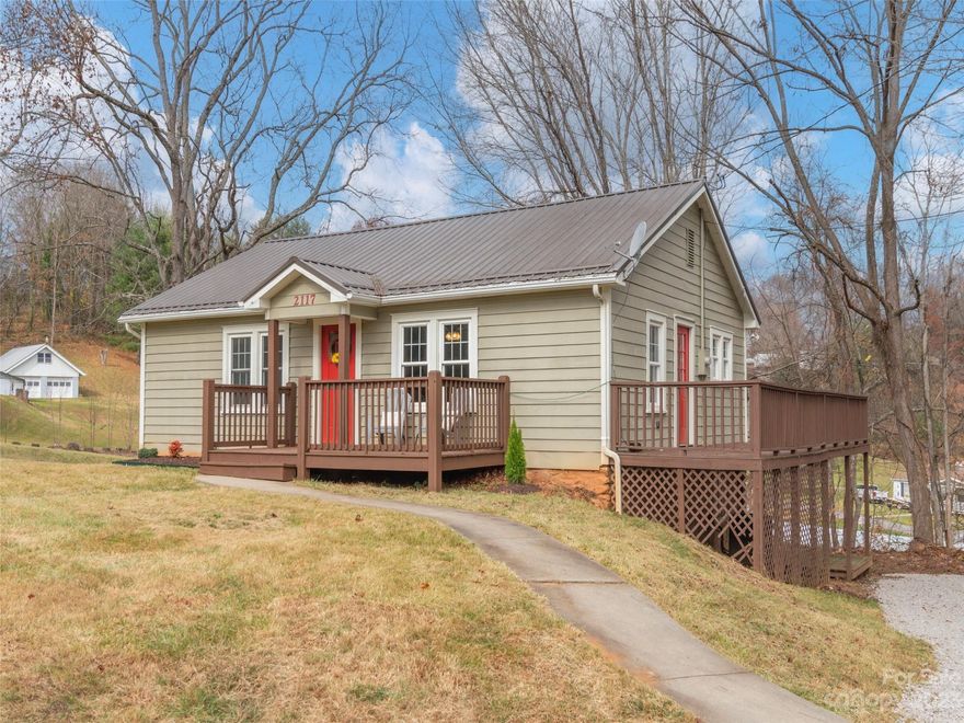 This updated bungalow is ready to steal your heart! Located just moments from Waynesville and Canton and only 25 minutes to Asheville, the location is extremely convenient to grocery, dining, parks, hospital, shopping, and outdoor activities. Awesome yard for pets and kids. Custom kitchen will make holiday gatherings even more special! Your spa baths are ready with tile showers and modern vanities! Nice deck spaces for entertaining! Fresh gravel, recently updated paint and bamboo hardwood flooring. Updated appliances convey. Come see!