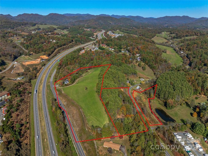 This expansive 15.65 acre tract offers excellent visibility and accessibility just off I-26 and exit 9 to Mars Hill.  The site’s combination of rolling topography and ridgeline allow for optimized earthwork to develop a highly-visible commercial or mixed-use product within minutes to downtown Mars Hill and Mars Hill University.  The site fronts a gravity sewer line along the new Crossroads Parkway extension.  Two points of ingress/egress are possible from Crossroads Parkway Extension and Calvin Edney Road.  A small portion of the property in the floodzone.