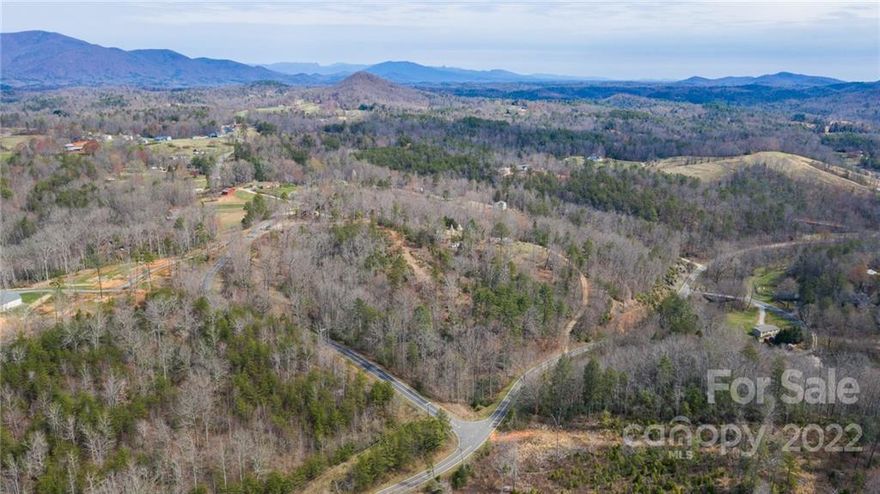 Ever dreamed of the perfect spot with beautiful mountain scenery? Five minutes to all the amenities of the mountain town of Old Fort. Easy access to surrounding areas of Marion, Black Mountain, and Asheville to name a few. Fantastic long range views from this beautiful property.  Mostly cleared land lays gentle with endless possibilities. Could be a great farm or residence. Unrestricted property to do what you wish. House plans may be conveyed along with builder information if interested. Septic and well permit are on file completed in 2020. Lot is ready to start building. Recent clearing and grading performed. Please come visit.