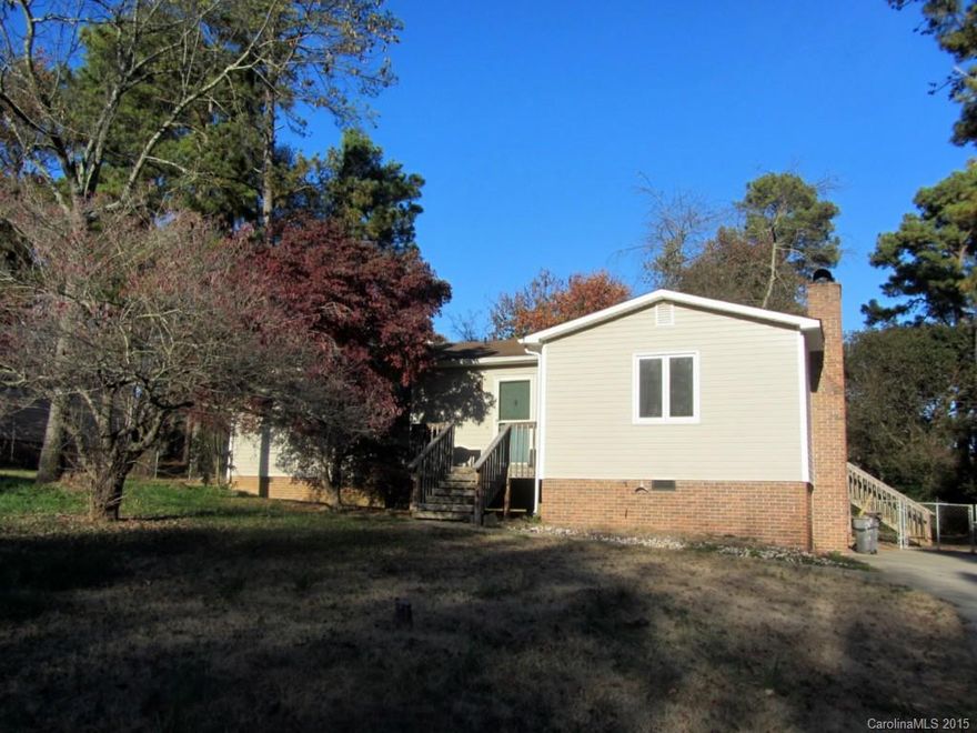 Own for less than rent!  This 3 bedroom, 2 bath home features new carpet throughout, family room with woodstove, large sunroom, eat-in kitchen, and fenced yard.  Some rooms have been freshly painted.  Ideal location is near interstate.  Easy access to shopping, dining, interstate, and more!