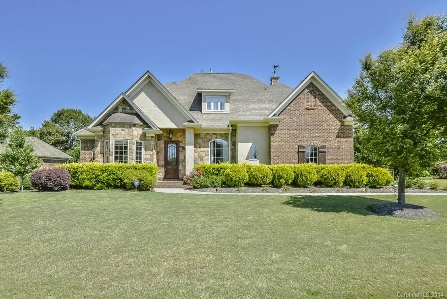 Come see this gorgeous custom home in Fort Mill!  This 4 bed/3.5 bath house (+theater) has upgrades galore, incl.custom moldings, gas fireplace in great rm, site-finished dark cherry hardwoods and hand scraped teak on the main, granite counters, stainless appl, Jenni-air gas stove/grill, and more. There are two masters with en suite baths, fenced yard w/ irrigation system, large deck and pergola.