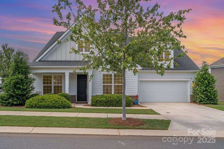 Welcome to this beautifully updated 1.5-story home in the sought-after Massey community of Fort Mill. This 4 bedroom, 4.5 bath home features TWO guest suites AND the primary suite on the main level, plus an upstairs guest suite & living room! The primary suite includes a custom closet & spacious walk-in shower, while the open-concept living area showcases a gourmet kitchen with a 36" cabinets, gas cooktop, quartz counters & massive island overlooking the dining and family rooms—complete w/ added ceiling fans & custom built-ins! Enjoy upgrades like a tankless water heater, freshly painted walls, added laundry cabinets w/ tile backsplash & utility sink, & a painted garage. Outdoor living is a dream w/ a paver patio, built-in fireplace, & added trees for privacy, all backing to a large green space. An irrigation system keeps the landscaping lush, & the community offers a pool with lazy river and slide, clubhouse with movie theater and workout room, & playgrounds for year-round enjoyment!