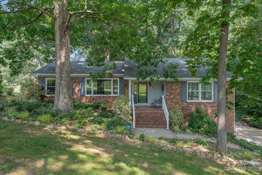 Professional photos to follow tomorrow! What a great opportunity to have a beautiful home in a super quiet neighborhood with the benefits of city services! This lovely brick home has so many great features. The yard is stunning! There is a huge, screened porch on the back of the home that adds fabulous outdoor living space! It has a newer roof, newer water heater and replacement windows. The range has a 5 burner natural gas cooktop. There are some hardwoods but also LVP and some carpet. Woodburning FP in the dining area. Hall bath has new flooring & cabinets & a new toilet. Master bath has been redone with a step-in shower and nice vanity. 2 car oversized garage in basement w/storage. New garage doors last year. Lots of light, beautiful place to call your new home!