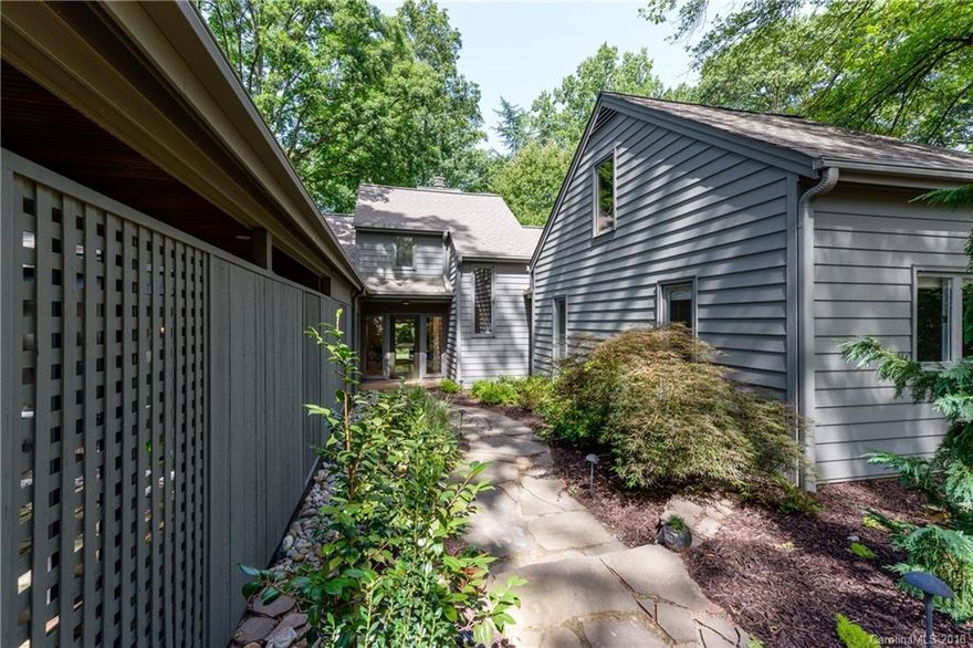 Hard-to-find, awesome contemporary home in the heart of Dilworth on one of the most sought out streets. Light, bright & open, this home features updated kitchen & baths, a cozy den, 2 story Great Room w/stacked stone fireplace, spacious rooms & a room downstairs that can be used as an office or playroom. The heavily wooded lot features gorgeous landscaping and a nice, private backyard. Within walking distance to restaurants, parks, & retail.