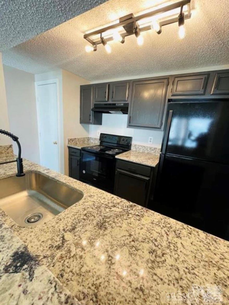 New and Improved Price - Come see this one today! Great opportunity for owners or investors to buy a clean/move-in ready 3 bed/2 bath condo featuring an updated kitchen, updated flooring,  and large balcony. Fantastic location walking distance to UNCC. Buy instead of renting while attending school and then rent it out after graduation!