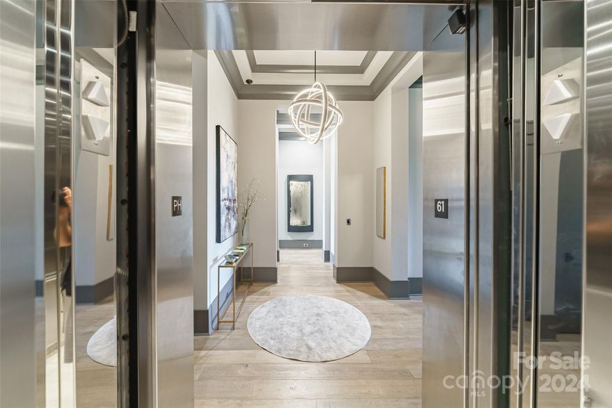 This modern penthouse is the epitome of luxury living. Step off your private elevator into the meticulously designed living space, fully equipped with Control4 smart home automation & integrated Josh.ai virtual assist. This exceptional residence boasts 3 bedrooms & 3.5 baths and 12ft ceilings. The great room complete w/a linear fireplace, flows effortlessly through accordion doors to a covered lanai, for the ultimate indoor-outdoor living experience. 
Gourmet chef’s kitchen w/top-of-the-line Wolf appliances, galley sink, quartzite countertops, Sub-Zero refrigerator, and custom cabinetry. For the wine enthusiast, a glass-enclosed wine closet for the finest collection. Escape to the primary suite, w/ vaulted ceilings & decorative beams. Unwind on your private balcony or pamper yourself in the spa-like primary bath, w/dual floating vanities, freestanding tub, Toto toilets, & tiled shower w/waterproof shower monitor. Boutique-inspired custom walk-in closet, is nothing short of a dream.