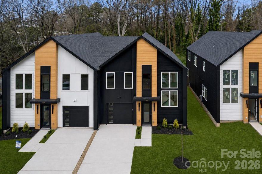 NOT all Charlotte townhomes are created equal, and 2412 Crestview Drive makes that clear from the moment you arrive. Tucked within an exclusive community of just six Duet-style homes, this address offers something increasingly rare in the city: genuine privacy. A protected tree save wraps the rear of the property, giving you a natural backdrop that buffers the noise, softens the view, and creates the kind of quiet that most in-town buyers have stopped expecting. WHAT sets this home apart goes beyond the setting. Built by Madison-Simmons Homes, a local Charlotte builder with deep roots in the community and a hands-on approach to quality that shows in every detail, this isn't production builder standard. The craftsmanship is intentional, the finishes are elevated, and the difference is something you feel the moment you walk through the door. INSIDE, the 2,317 sq ft Crestview Plan offers three bedrooms plus a dedicated office, two and a half baths, and an open-concept main living area anchored by a chef-inspired kitchen with a generous quartz island and tray ceilings overhead. Premium Revwood flooring runs through the main level, and every finish was chosen with longevity and livability in mind. UPSTAIRS, the primary suite is a genuine retreat. Spacious and serene, it features a spa-inspired ensuite with an oversized shower and upscale finishes that turn a nightly routine into something worth savoring. OUTSIDE, a private Trex deck looks out over the trees, a covered patio sits below, and an attached one-car garage adds everyday convenience. Andersen soundproof windows throughout keep the outside world where it belongs. ALL of this, minutes from Uptown Charlotte, South End, and easy access to I-85. Homes in this community are selling. Schedule your showing today.