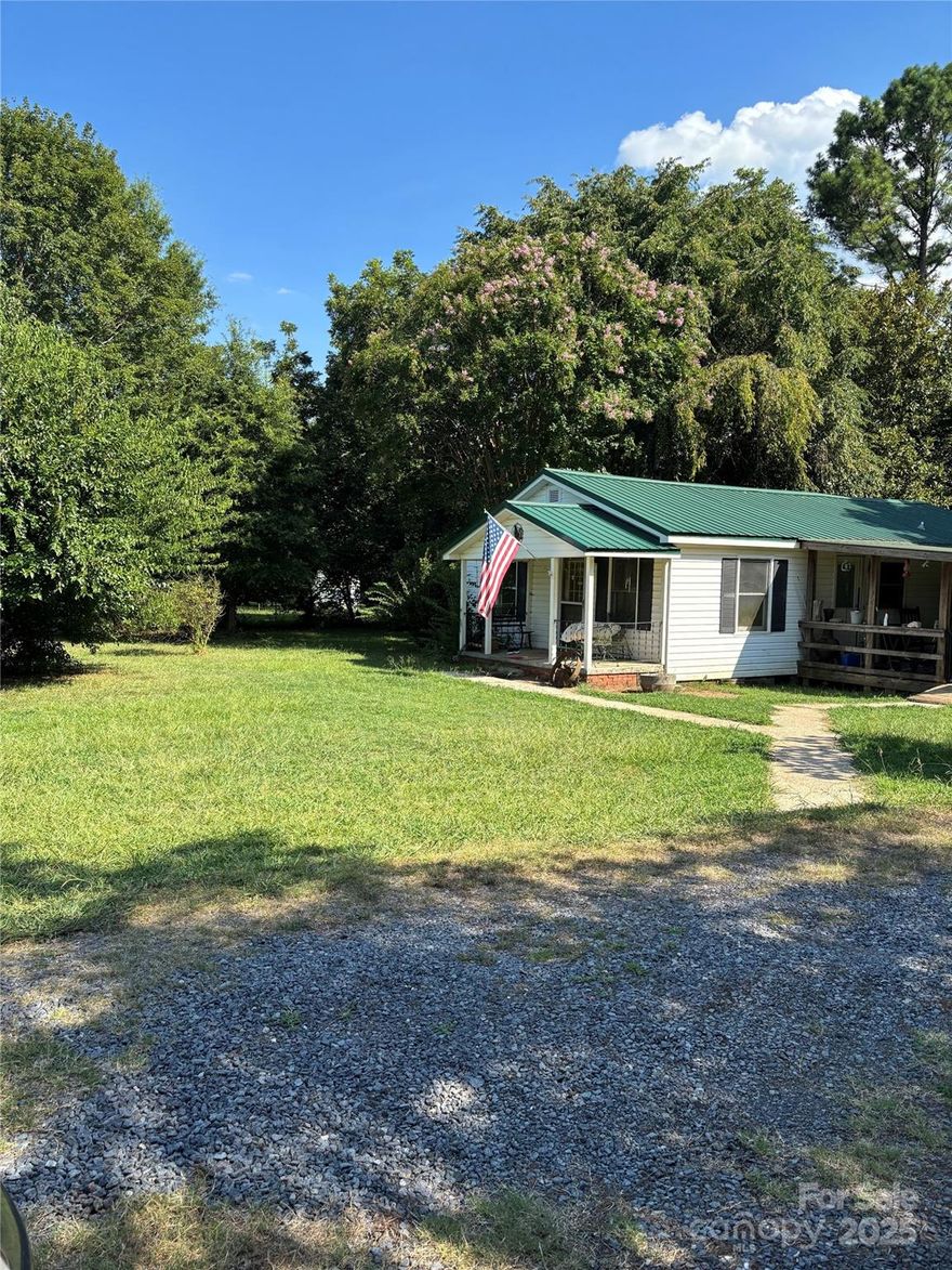 Opportunity Knocks in York, SC! Priced for potential, this 1961, 3-bedroom, 2-full-bath home sits on a beautiful 1.32-acre level lot in York, SC. The expansive property features a mix of trees and open space, offering a truly serene environment. Inside, much of the home has been prepared for renovation, giving the new owner a fresh start to design their custom interior. Upgrades are needed and reflected in pricing. The home is habitable. Enjoy the beautiful surroundings from the large covered porch, ideal for relaxation and and entertaining. Don't miss this chance to create your personalized sanctuary!