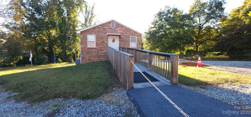 Only 2 Blocks From The New Saluda Trail!!   (https://conservingcarolina.org/saluda-grade/)  - Local Church in Landrum is selling their "Fellowship Hall" and event center.  The building is 2 stories with room for seating over 65 people.  Each floor is set up with multiple tables, chairs, and entertaining items.  The main floor, which is street level, has a wheelchair ramp, a full bathroom and a 1/2 bath.  There is also a private bedroom for traveling missionaries or guests.  The lower level consists of 2 dining rooms, a large kitchen, a pantry/storage area, and entertaining areas.  Great opportunity for another church or local community group to use.  Could potentially be converted to residential. Lots of parking.  Call Agent With Questions.