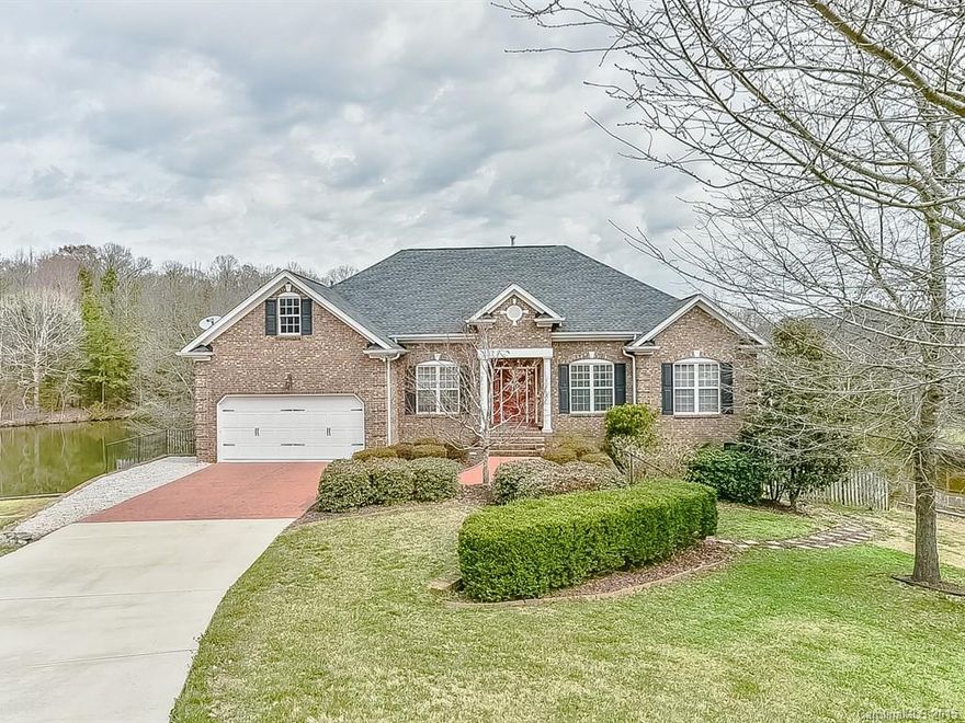 Stunning waterfront home with panoramic views of the lake.  This home offers a totally brand new updated kitchen with 42" cherry cabinets, new granite, new SS appliances, under counter lighting and kick plate lighting.  New A/C unit for 1st floor.  New tankless H20 heater.  New fireplace in living room with built-ins.  Refinished hardwood floors.  New light fixtures & recessed lighting.  New paint. Full kitchen in basement with bedroom/bath for in-law suite.  Newer roof.  Must see to appreciate!