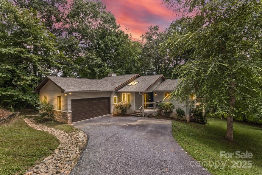 3bed/3.5bath home in Mills River, blends comfort and tranquility in a beautiful mountain setting. Dual primary suites - ideal for multi-generational living or a private retreat - and bonus room make this property adapt to meet your needs. The main living area is bright and inviting, with abundant natural light and an open layout that flows into the dining space and kitchen. A generous dining area leads out to the freshly rebuilt deck overlooking the backyard. Find yourself sipping morning coffee, hosting weekend barbecues, or simply relaxing while taking in the fresh mountain air. The backyard offers ample room for gardening, play, or pets to roam. Assumable loan. Minutes from the vibrant towns of Asheville, Hendersonville, and Brevard, giving you easy access to boutique shopping, award-winning dining, and endless outdoor recreation. Whether you’re seeking a full-time residence or a mountain getaway, this home offers the perfect balance of small-town charm and modern convenience.