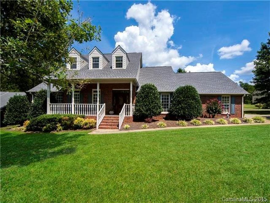 A full brick low country home with a fantastic rock chair front porch . Split bedroom plan with all four bedrooms on the main including the master Suite. Hard wood floors through out with 10+ feet high ceilings. Updated kitchen featuring granite counter tops, stainless Steel Refrigerator and a breakfast area. Great Room with masonry fireplace  Take a walk through the quiet neighborhood with views of the pond. Enjoy  three bonus rooms upstairs, a great corner lot, a garage with a workshop, & more