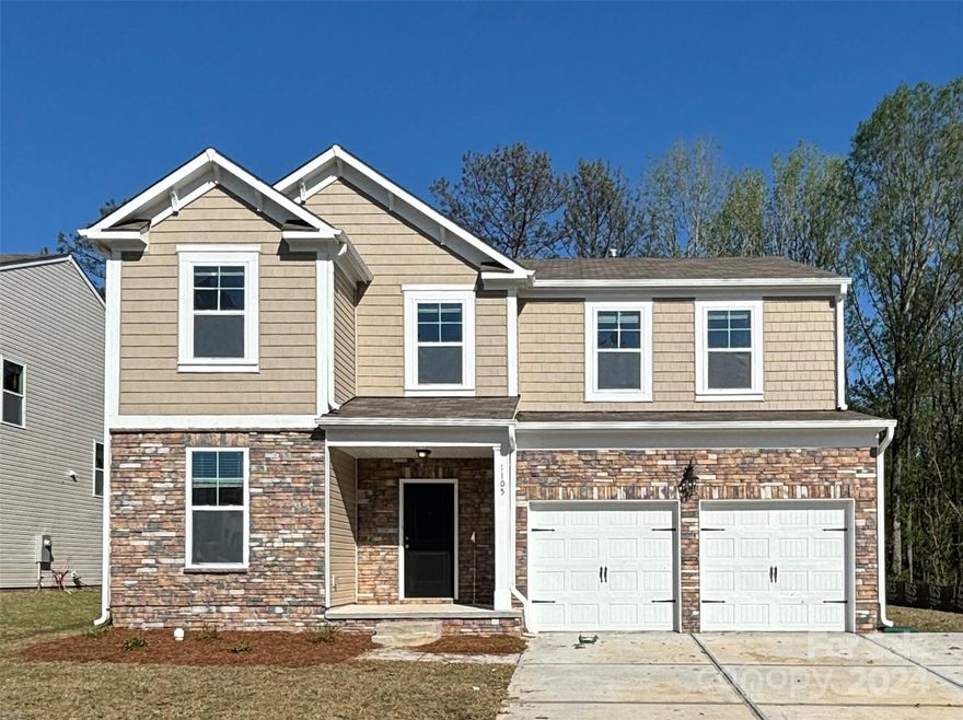 This home has 5 bedrooms and 3 bathrooms. There is a guest suite down, with a full bath, perfect for accompanying visiting family or extra guests. The main floor features 9' ceilings, 42" upgraded kitchen cabinets, quartz countertops, a large kitchen island with seating, stainless appliances, a mud room, engineered vinyl plank flooring, and a stone fireplace. The primary bedroom is spacious with the primary bath containing a separate garden tub and shower with a semi-frameless surround. There are 4 secondary bedrooms up with a loft. Community is conveniently located just over a mile from Old Town Rock Hill, Winthrop University and Knowledge Park with many great restaurants, shops, breweries and entertainment options nearby and more coming soon. Come view today!