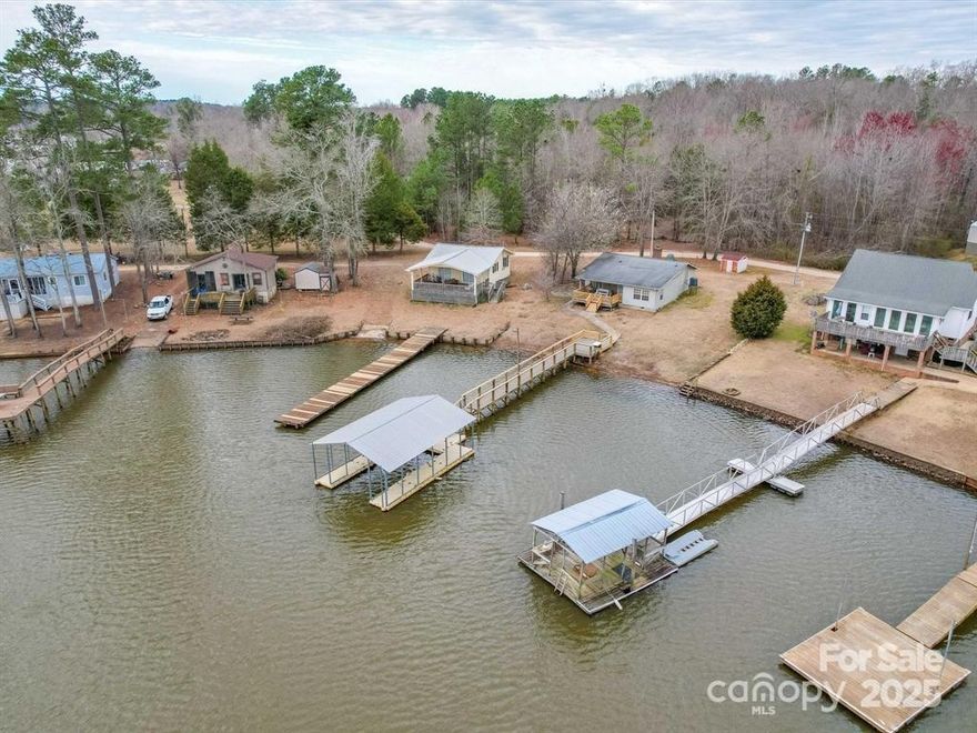 Escape to the serene beauty of waterfront living at 2460 Cottage Lane in Liberty Hill, South Carolina. This charming, cozy residence offers an unparalleled opportunity to reside literally on the water's edge, complete with your own private dock (with new Trex Decking), inviting you to embrace a lifestyle of tranquility and natural splendor. Offered fully furnished, this home with two bedrooms and two and a half bathrooms, provides comfortable and intimate living spaces, ideal for those seeking a peaceful retreat from the hustle and bustle of daily life. Imagine waking to the gentle lapping of water against your private dock, enjoying your morning coffee as the sun rises over the lake, and spending evenings watching the vibrant colors of sunset reflect across the water's surface. This property is more than just a home; it's a sanctuary where you can create lasting memories, indulge in the joys of lakeside living, and experience the calming influence of nature.

Use preferred lender to buy this home and receive an incentive towards your closing costs!