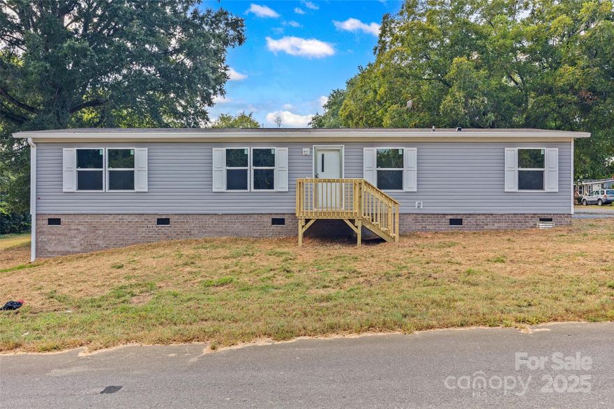 Welcome to your brand new manufactured home at 2246 Myers Street in Rock Hill — where affordability meets modern living! Nestled in a quiet location with quick access to I-77, this is your ideal opportunity for convenient commuting to Charlotte and beyond.
Step inside to discover an open-concept floor plan that maximizes both space and function. The kitchen features quality cabinetry, solid surface counters, and space for a casual dining area. The living area is bright and welcoming, perfect for everyday living or entertaining. The primary suite provides a private retreat with a roomy closet and a comfortable ensuite bath. Two additional bedrooms and a full hall bath ensure plenty of room for family or guests. Brand-new systems and finishes throughout: durable flooring, energy-efficient windows and modern fixtures. Outside, enjoy a low-maintenance lot with ample room for a grill or small garden. There’s parking convenience, and the location offers easy access to shopping, dining, and essential services.
Don’t miss this rare chance to own a new home in a commute-friendly location at a great value. Schedule your showing today!
Home is in the process of being De-titled by Tracey Reynolds Real Estate Law Group.