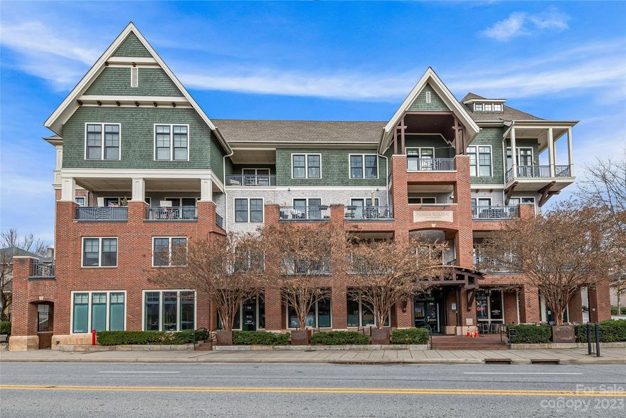 Incredible downtown living! Updated & private 1 bedroom condo located steps from local shops, restaurants and vibrant entertainment in Asheville's DT district. Perfect for year-round or part-time lock-and-leave living, this beautiful residence offers an open floor plan with lots of natural light, high-end amenities, 10’ ceilings, luxurious and spacious tile bathroom, and incredible outdoor living space with oversized covered porch (adding an addt'l 200 sq ft)! All the perks of city living with added security: enjoy living on the top floor with elevator access, plus a gated/coded entry & a reserved parking space! Located in the coveted Pioneer Building above High-Five Coffee and next to Whole Foods grocery, Trader Joe’s, and Harris Teeter; Steps to the Greenway and & close to historic Montford & UNCA. Community features include a top floor gathering room, fitness center, private storage and rooftop terrace with stunning views across DT Asheville and the surrounding Blue Ridge Mountains.