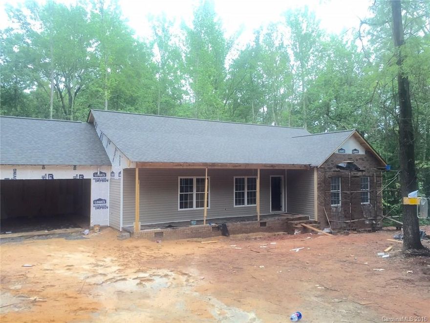 New Construction &  still available options to pick as well as appliances, custom built cabs, 3 Bdrm, 2 bath split floor plan on over 1 acre, wooded and in the Clover School District. Home has a great covered front porch and a beautiful covered back deck overlooking the wooded lot w/ the privacy of nature. Must see- it will not last. In sheetrock stage. Master has beautiful tray ceiling & Great room has a vaulted ceiling.  Bonus room w-separate door leading off to the deck as well, 2 car garage